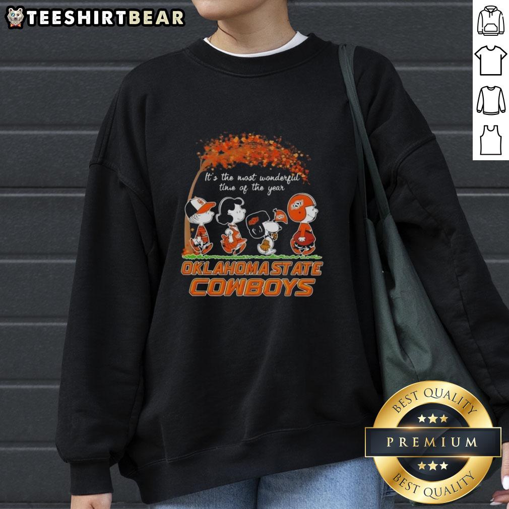 Alt Text: Premium Oklahoma State Cowboys X Peanuts Snoopy and Friends Autumn sweatshirt featuring vibrant fall designs.