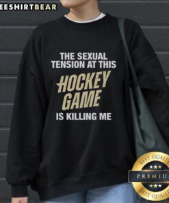 Premium sweatshirt featuring 'The Sexual Tension At This Hockey Game Is Killing Me' design, perfect for hockey fans.