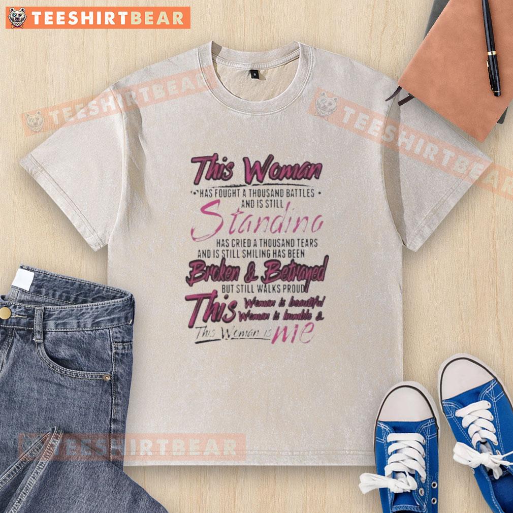 Premium washed t-shirt featuring inspiring quote about resilience and strength: 'This woman has fought a thousand battles.'