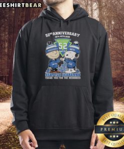 Alt Text: Stylish Seattle Seahawks outfit featuring a Snoopy and Charlie Brown hoodie for the 52nd anniversary (1974-2026).