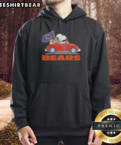 Pretty Snoopy and Woodstock in Chicago Bears football hoodie, riding on a car, showcasing team spirit and fun.