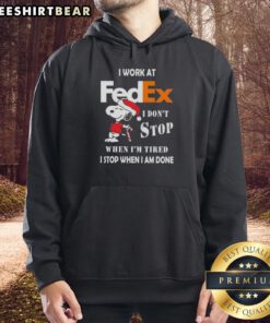 Alt Text: Pretty Snoopy Christmas hoodie with 'I work at FedEx, I don't stop when I'm tired, I stop when I'm done' text.