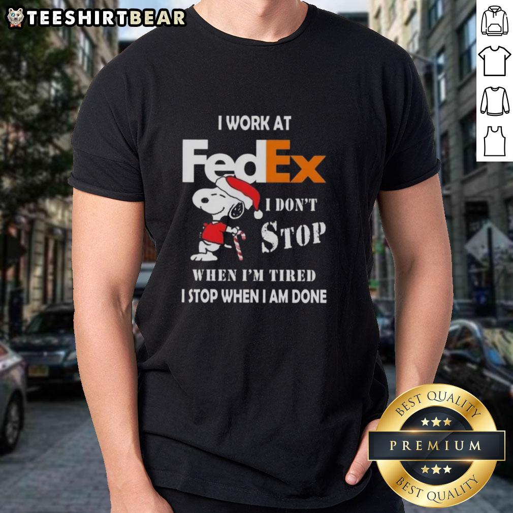 Pretty Snoopy Christmas T-Shirt for FedEx workers: 'I Don't Stop When I'm Tired, I Stop When I'm Done' design.