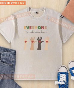 Top Everyone Is Welcome Here washed t-shirt in vibrant colors, promoting inclusivity and comfort for all wearers.