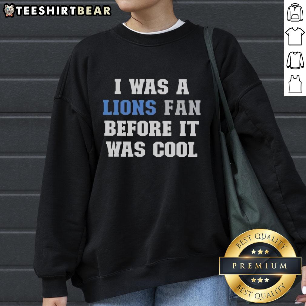 Cozy 'I Was A Lions Fan Before It Was Cool' sweatshirt featuring bold graphic design, perfect for Detroit Lions fans.