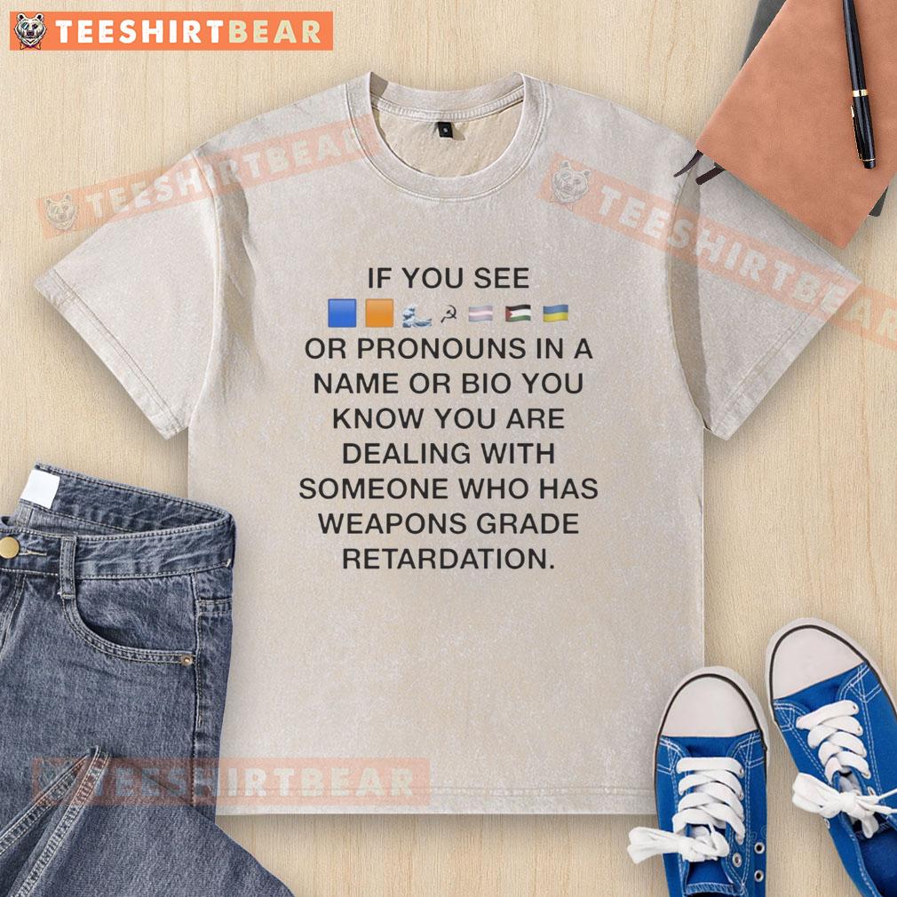 Colorful flags washed T-shirt with pronouns, symbolizing inclusivity and identity in personal bios and names.