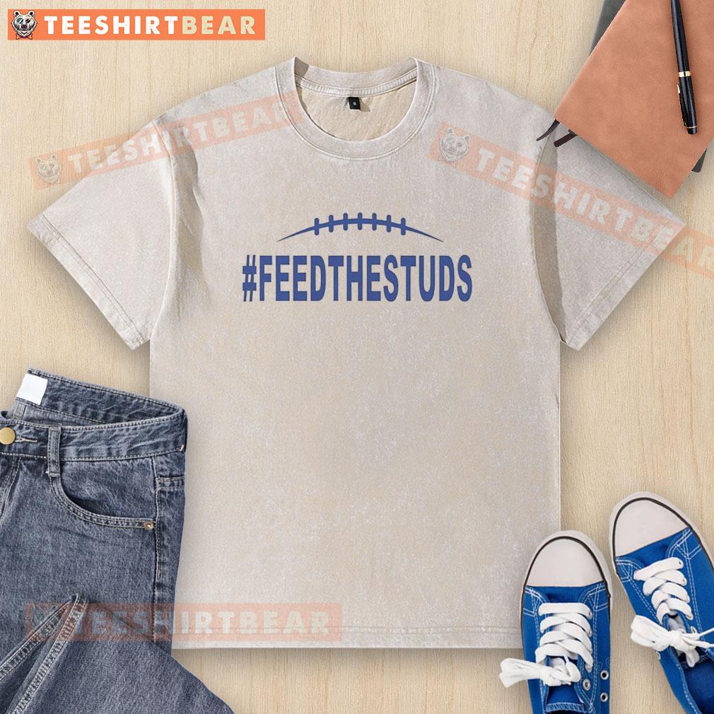 Alt Text: Top Mark Stoops Kentucky Wildcats Football 'Feed The Studs' logo on a washed t-shirt, perfect for fans.