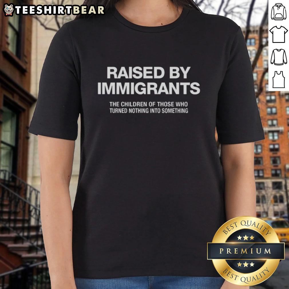 Melissa Ortiz wearing a Raised By Immigrants ladies tee, celebrating the journey of those who turned nothing into something.