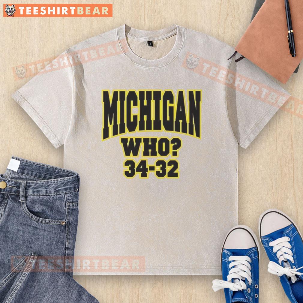 Alt Text: Top Michigan Who 34-32 washed t-shirt featuring a vintage design, perfect for fans and casual wear.