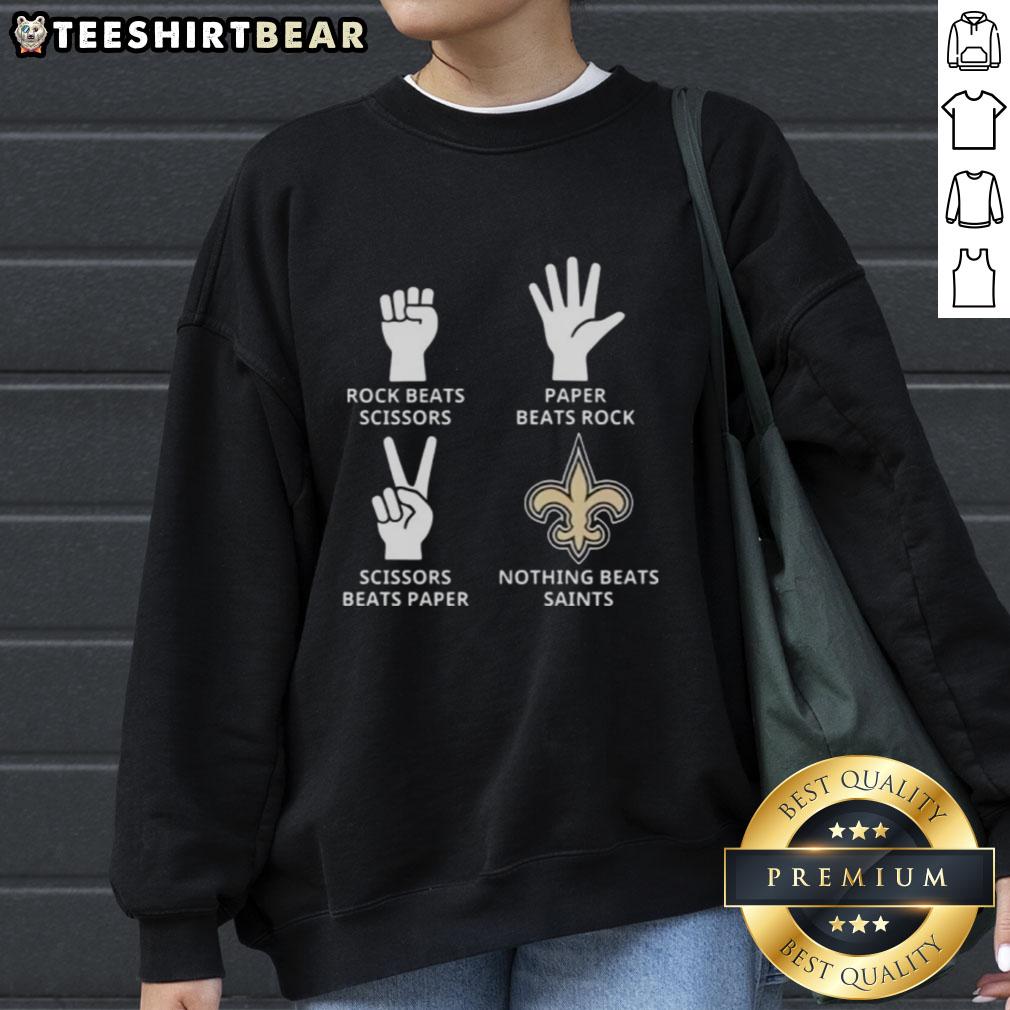 Cozy sweatshirt featuring the New Orleans Saints logo with the phrase 'Nothing Beats Rock, Scissors, Paper Beats Rock.'