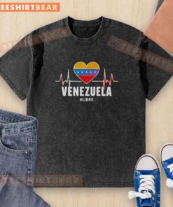 Alt Text: Heart-shaped design on a washed t-shirt featuring 'Awesome Venezuela' and 'Libre Heartbeat' for stylish casual wear.
