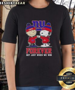 Cute Peanut Snoopy and Charlie Brown graphic on a New York Giants tee for ladies, perfect for fans year-round.