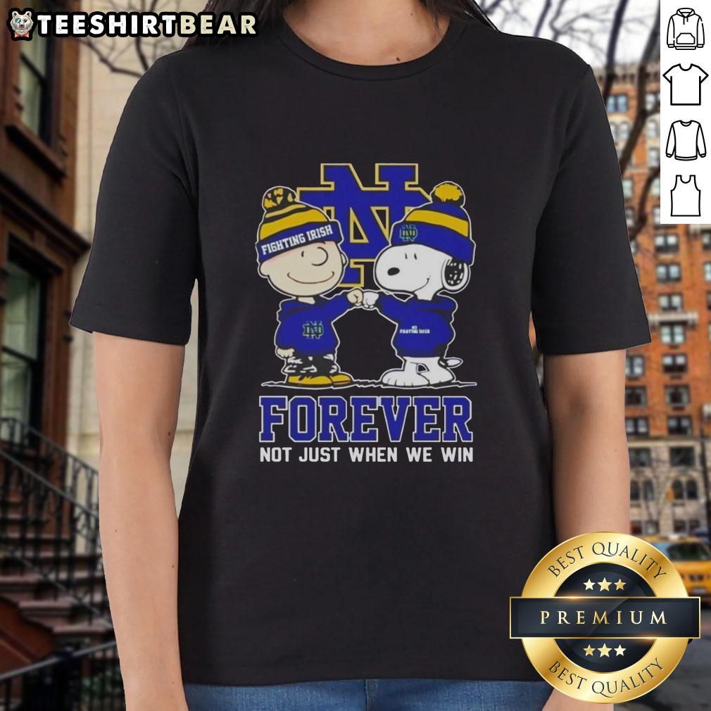 Adorable Snoopy and Charlie Brown graphic on a ladies tee, celebrating Notre Dame Fighting Irish spirit forever.