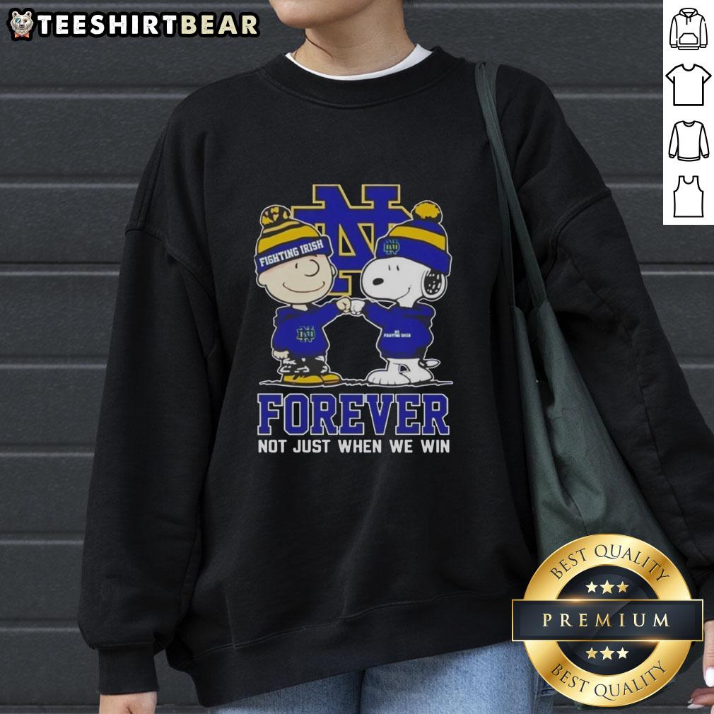 Alt Text: Cute Peanut Snoopy and Charlie Brown sweatshirt featuring Notre Dame Fighting Irish Forever design. Perfect for fans!