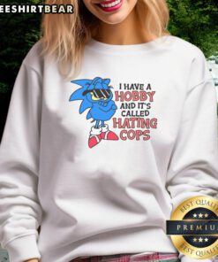 Funny sweatshirt featuring Garfield and Sonic with the phrase 'I have a hobby called hating cops' perfect for casual wear.
