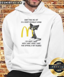 Funny tired cat wearing a hoodie with 'Grumpy McDonald's Woman' text, showcasing a sassy attitude and humor.