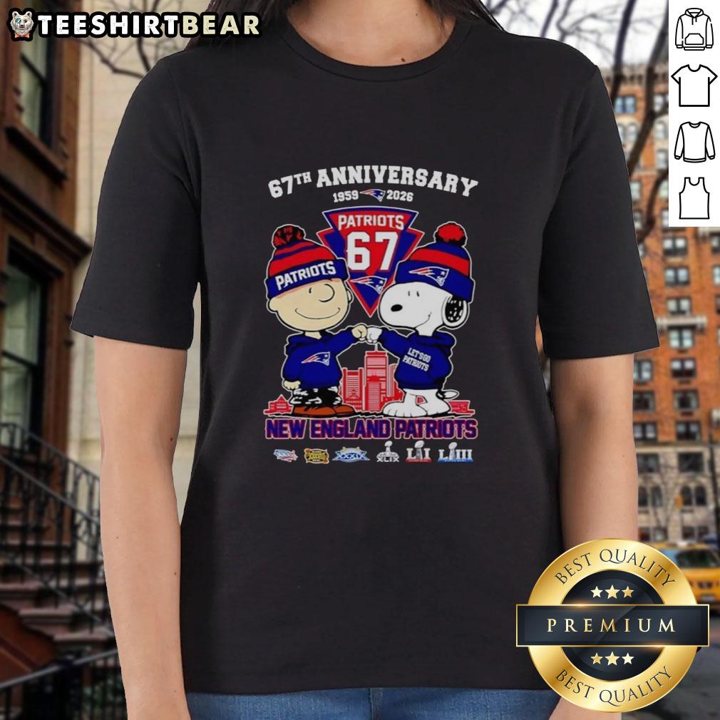 Alt Text: Happy Snoopy and Charlie Brown in New England Patriots football gear, celebrating 67 years of history on a ladies tee.