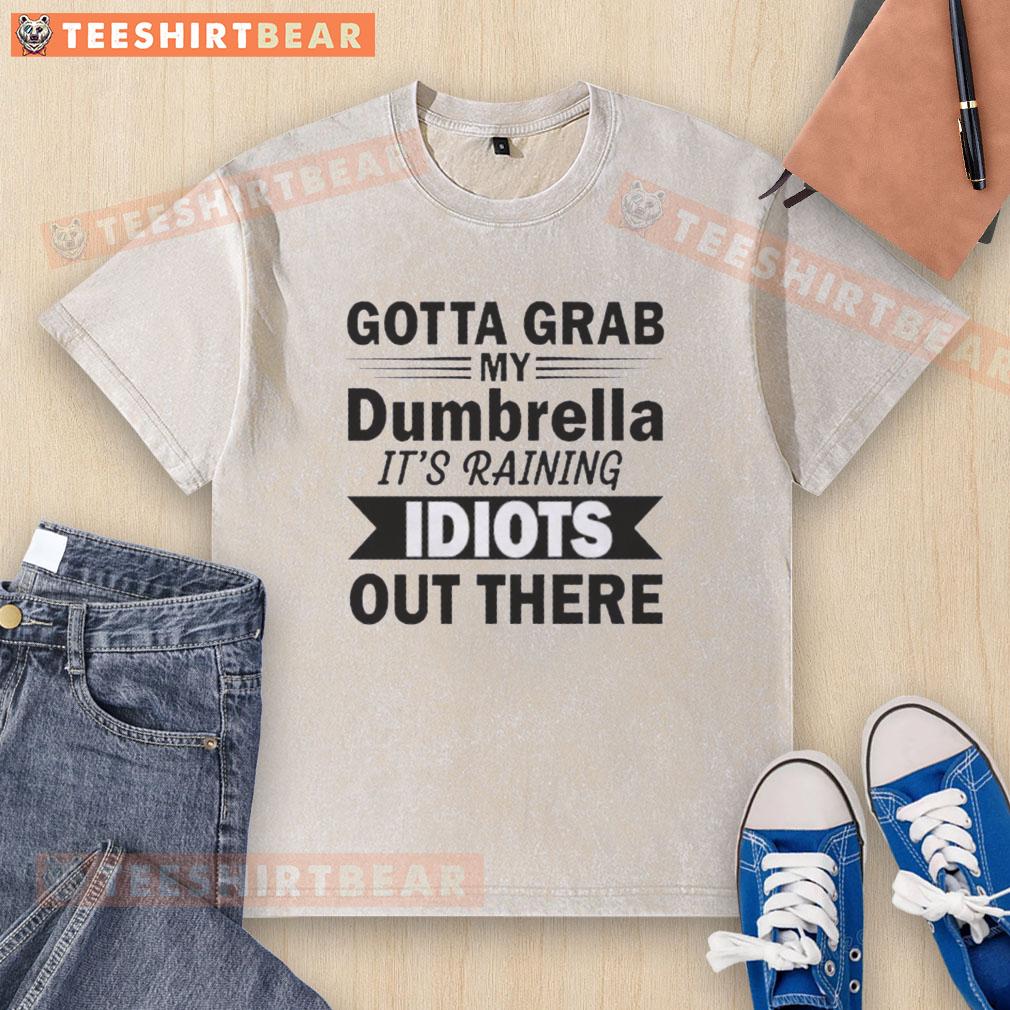 Alt Text: Funny washed t-shirt featuring 'Hot, Gotta Grab My Dumbrella, It's Raining Idiots Out There' quote design.