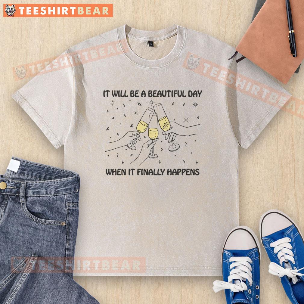 Washed t-shirt with 'Nice It Will Be A Beautiful Day When It Finally Happens' text in vibrant colors on a sunny background.