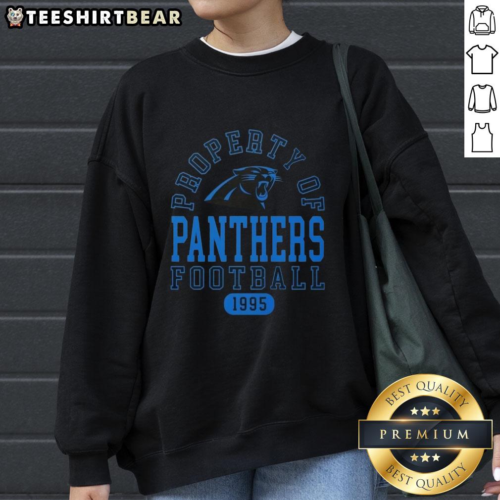 Carolina Panthers football sweatshirt, featuring a stylish design and logo, perfect for fans since 1995.