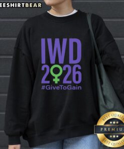 Official International Women's Day 2026 'Give To Gain' sweatshirt featuring empowering design and vibrant colors.