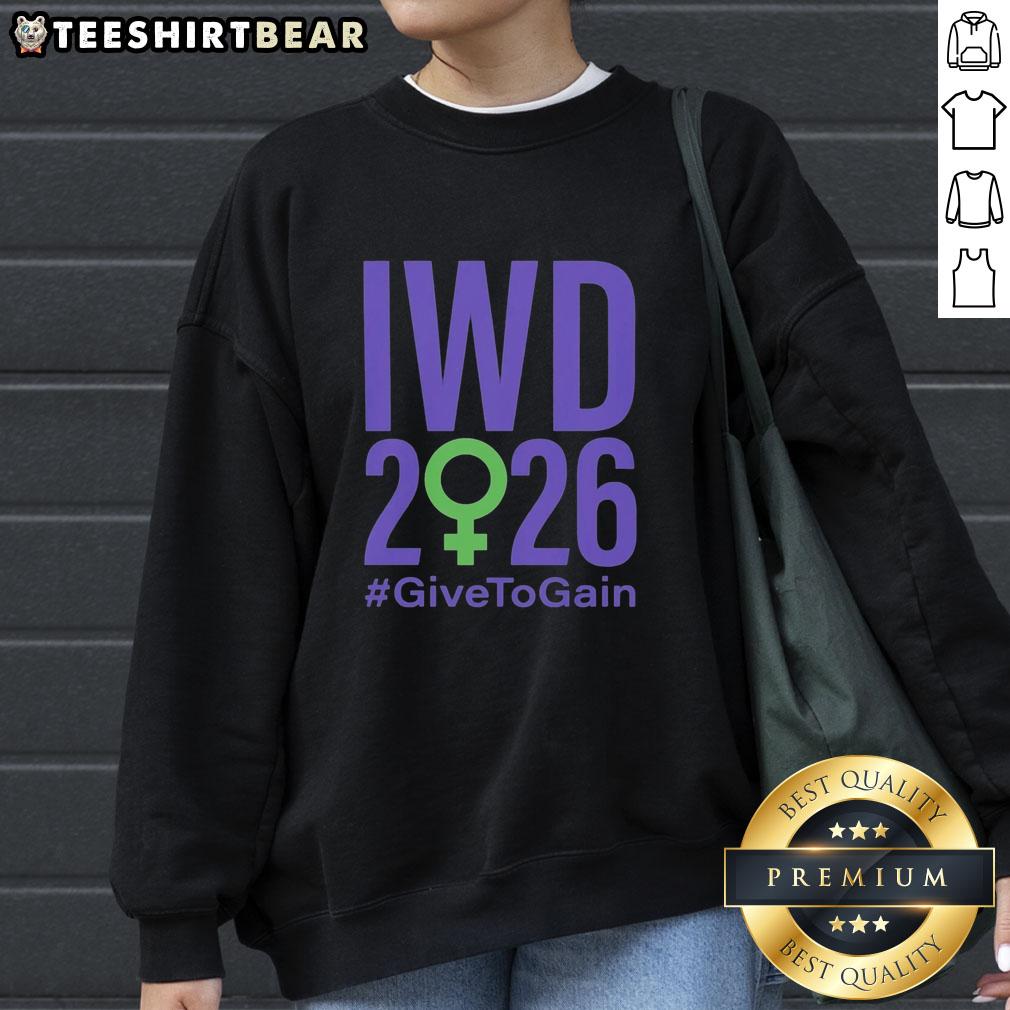 Official International Women's Day 2026 'Give To Gain' sweatshirt featuring empowering design and vibrant colors.