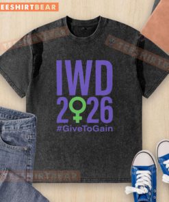 Official International Women's Day 2026 'Give to Gain' washed t-shirt featuring a stylish design and empowering message.