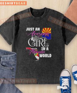 Official Just An Arizona Girl In A Florida World washed t-shirt displayed on a hanger, showcasing a casual summer style.