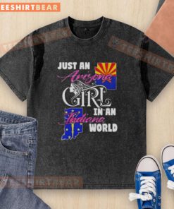 Official Just An Arizona Girl In A Indiana World washed t-shirt displayed on a rustic wooden background.