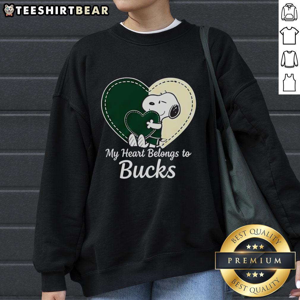 Official Milwaukee Bucks x Snoopy cartoon Valentine 2026 sweatshirt featuring vibrant graphics and team colors.