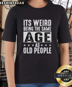 Vintage ladies tee featuring the phrase 'It's Weird Being The Same Age As Old People' for a fun, nostalgic vibe.