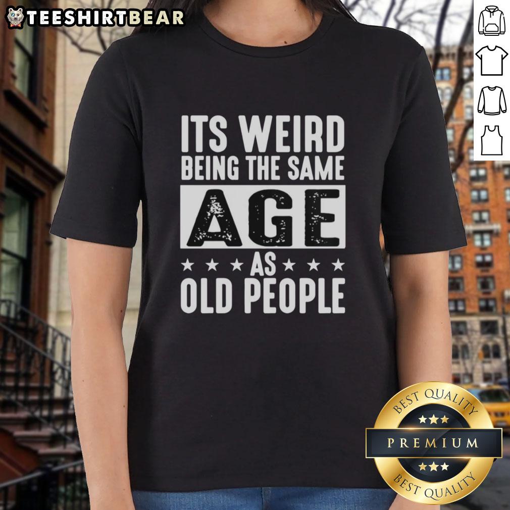 Vintage ladies tee featuring the phrase 'It's Weird Being The Same Age As Old People' for a fun, nostalgic vibe.