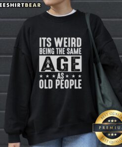 Vintage sweatshirt featuring 'It's Weird Being The Same Age As Old People' design, perfect for nostalgic fashion lovers.