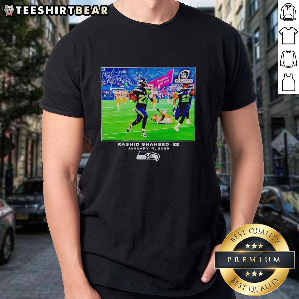 Alt Text: Original Seattle Seahawks Rashid Shaheed NFL Flash Features T-Shirt showcasing vibrant team colors and logo.