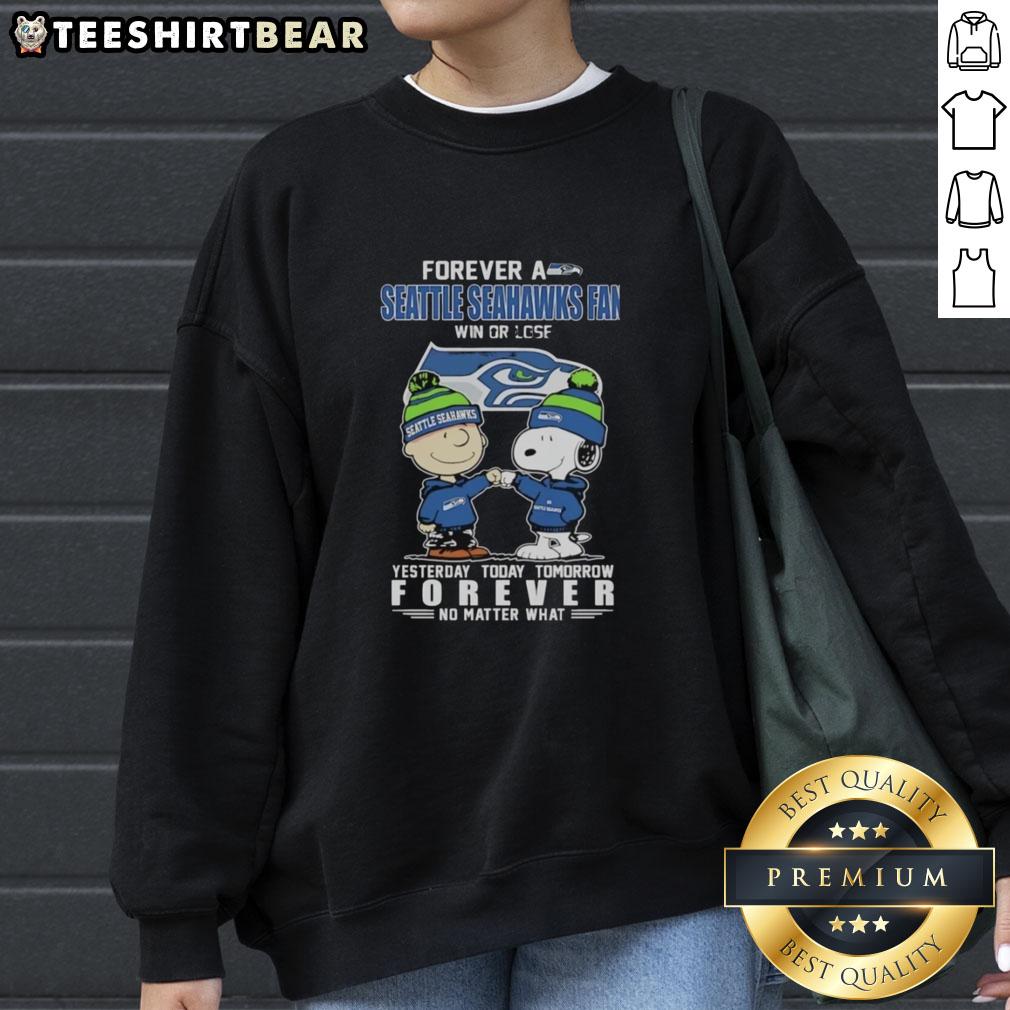 Pretty Charlie Brown fist bump with Snoopy on Seattle Seahawks fan sweatshirt, showcasing loyalty win or lose.