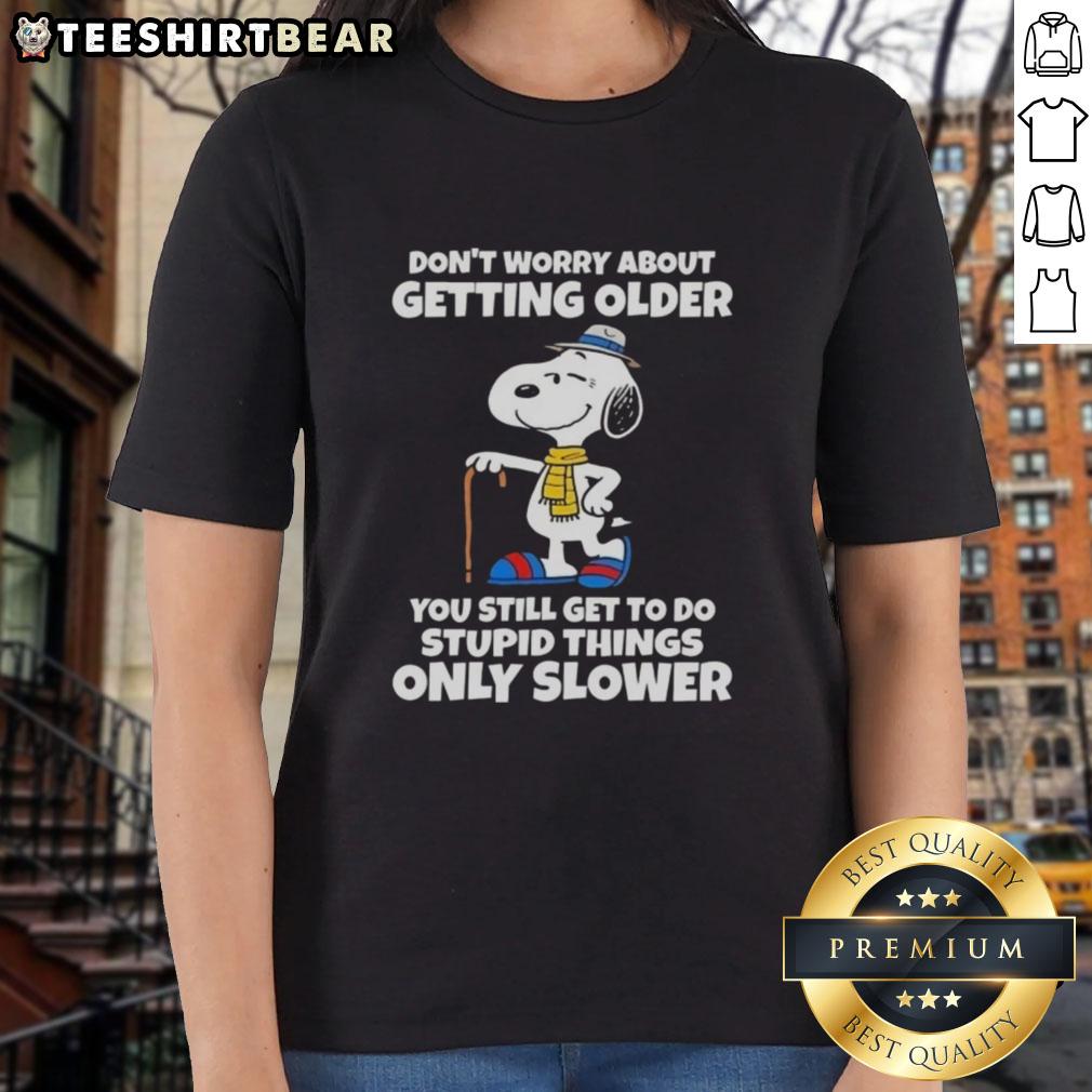Pretty Snoopy graphic tee for ladies with 'Don't Worry About Getting Older' text, perfect for celebrating fun moments.