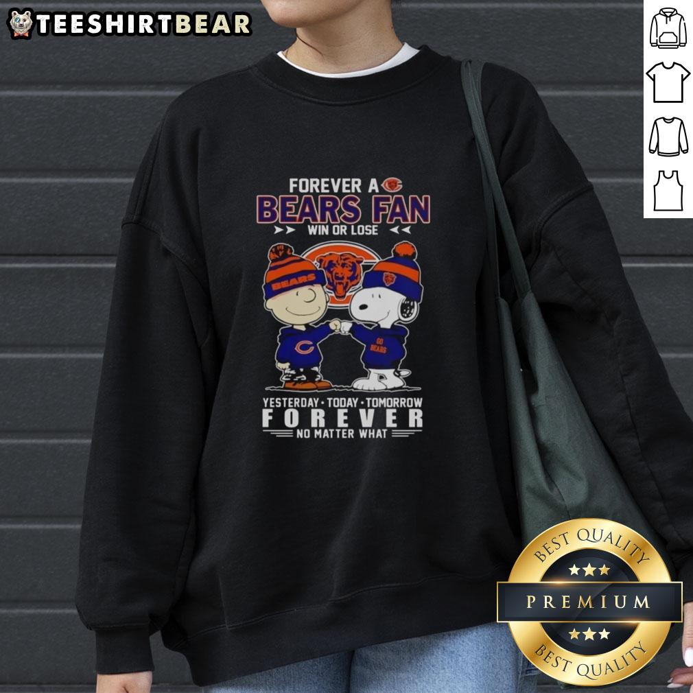 Charlie Brown fist bumping Snoopy in a Chicago Bears sweatshirt, celebrating loyalty win or lose, perfect fan apparel.