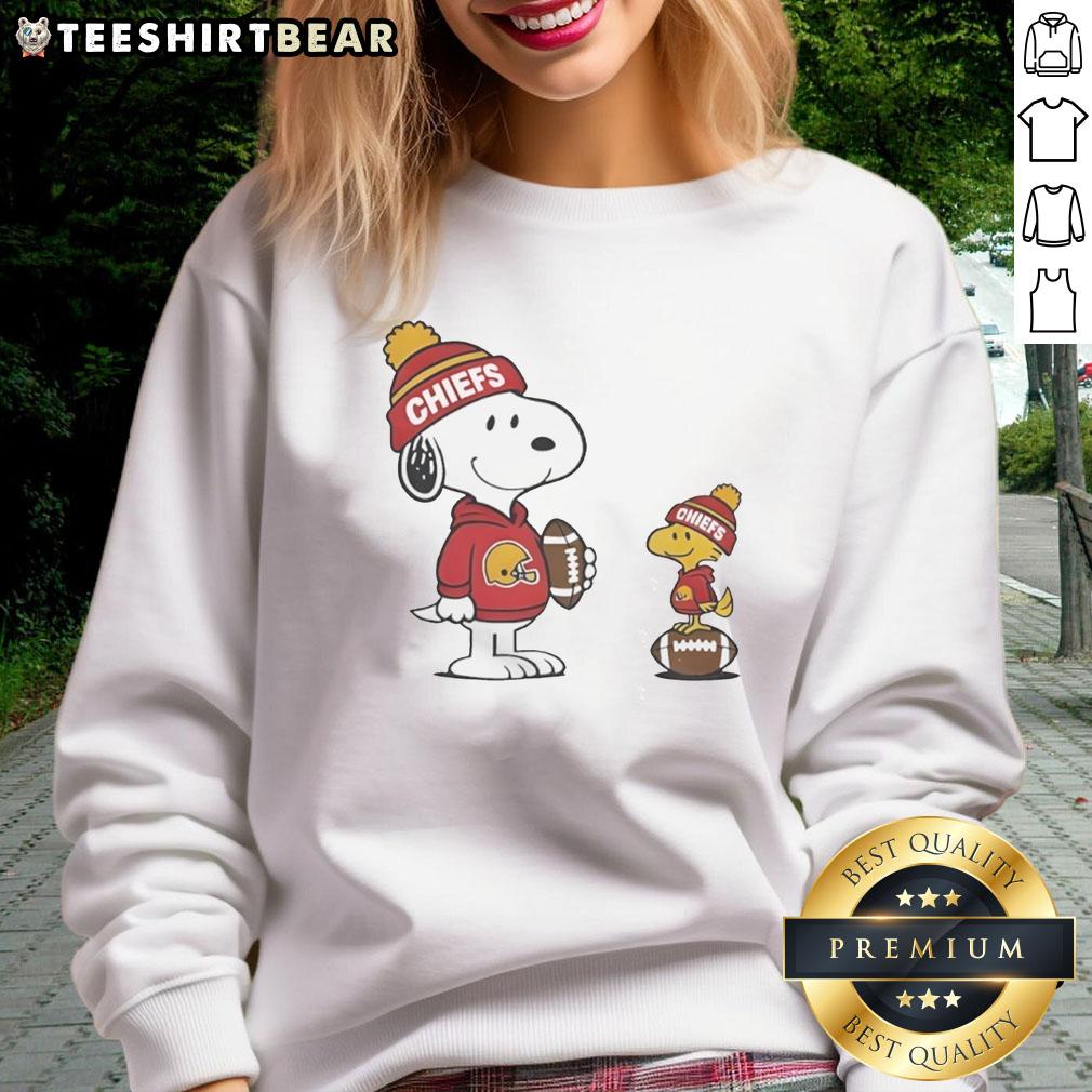 Alt Text: Cozy Kansas City Chiefs Snoopy Woodstock football sweatshirt perfect for NFL fans and chilly game days.
