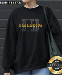 Cozy Top Telluride Bush sweatshirt displayed on a rustic wooden background, perfect for outdoor adventures.