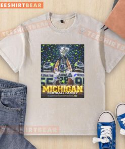 Awesome Oluwatimi Barner Morr of Seattle Seahawks holding trophy, celebrating with Michigan washed t-shirt. Congratulations!