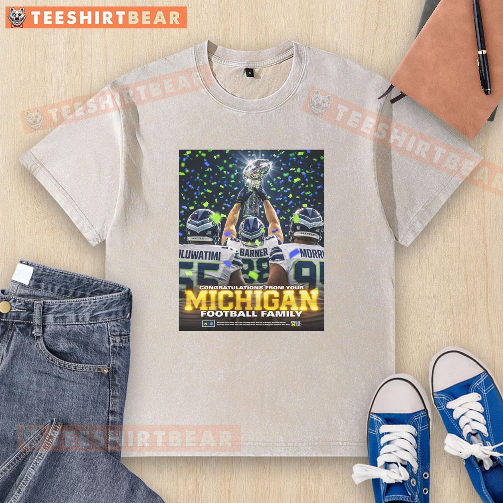 Awesome Oluwatimi Barner Morr of Seattle Seahawks holding trophy, celebrating with Michigan washed t-shirt. Congratulations!