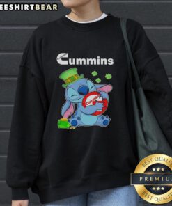 Cute Stitch with St. Patrick's Hug Cummins logo sweatshirt, perfect for festive celebrations and cozy wear.