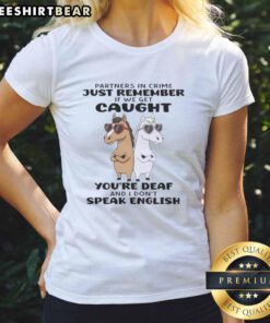Funny horses tee with text: 'Partners in crime - If caught, you're deaf and I don't speak English.' Perfect for horse lovers!