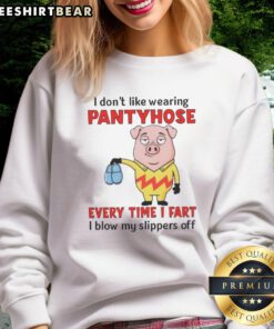 Funny pig in a sweatshirt with a humorous quote about pantyhose and farting, embodying playful pet humor.