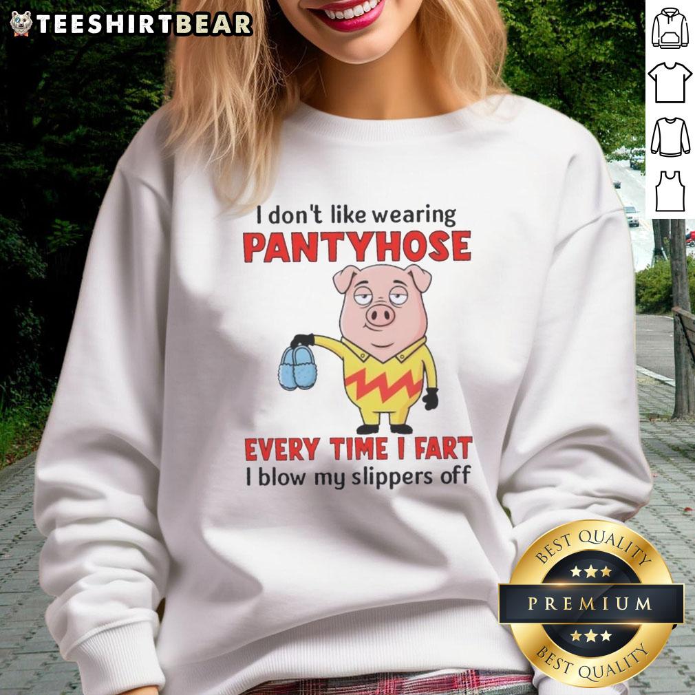 Funny pig in a sweatshirt with a humorous quote about pantyhose and farting, embodying playful pet humor.