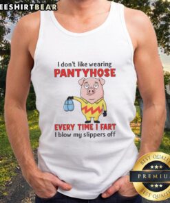 Funny pig wearing pantyhose on a tank top, humorously expressing dislike for them as it blows off slippers when farting.