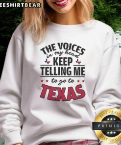 Funny sweatshirt with the phrase 'The Voices In My Head Keep Telling Me To Go To Texas' for humor and style enthusiasts.
