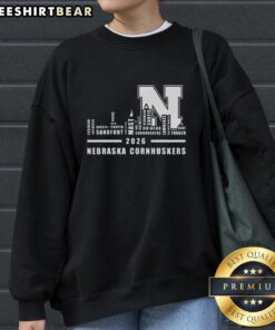 Good 2026 Nebraska Cornhuskers sweatshirt featuring city skyline design and all names, perfect for fans and alumni.