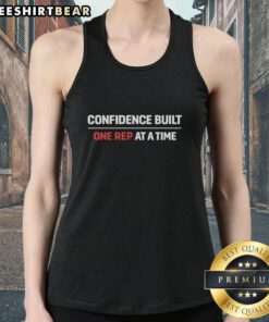 Good Confidence Built One Rep At A Time Tank Top displayed on a hanger, perfect for fitness enthusiasts and gym lovers.