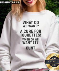 Hot sweatshirt featuring 'What Do We Want? A Cure for Tourettes!' slogan - perfect for raising awareness and showing support.